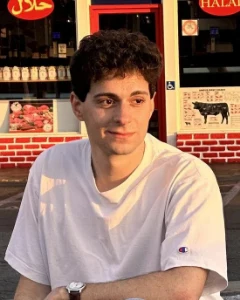 Bassel Lawand in a white tee, in warm evening light